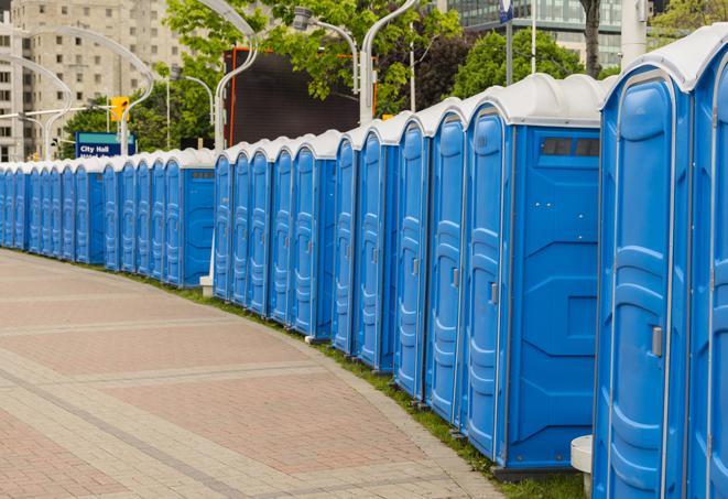 a row of sleek and modern portable restrooms at a special outdoor event in Crystal Lake IL